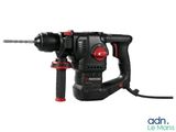 a black and red drill with a cord attached to it