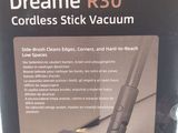 the box of a vacuum cleaner with a cordless stick attached