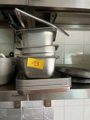 many pots and pans on the counter in the kitchen