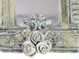 a picture of a picture frame with flowers in it