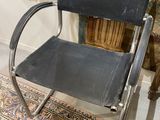 a chair that is sitting on a rug in a room