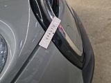 a sticker on the front of a car that says autopay