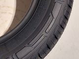 a close up of a tire on a white surface