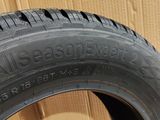 a close up of a tire on a cardboard box with a cardboard box in the background