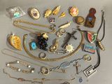 a lot of jewelry that is laying out on the table