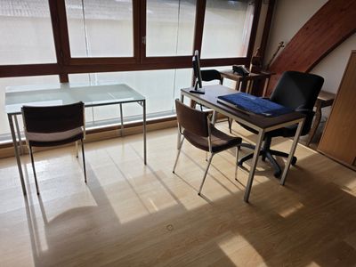 an image of a desk and chair in a room