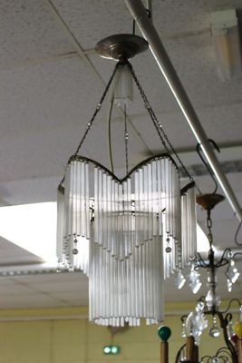 a chandelier hanging from the ceiling in a room