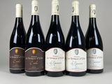 six bottles of wine lined up in a row on a table