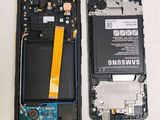 the back of a cell phone with a battery attached to it