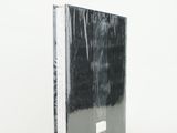a black and white photo of a book on a white surface