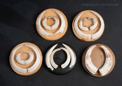 four different types of mushrooms are shown on a black surface