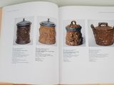an open book with a picture of different types of jars
