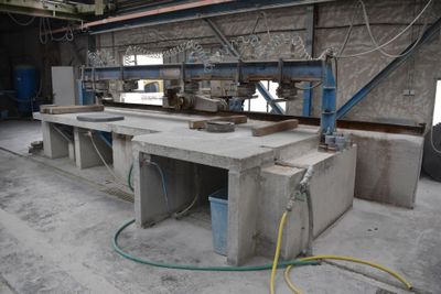 a concrete work area with a machine in the background