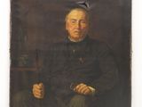 portrait d'un homme en uniforme militaire, assis sur une chaise