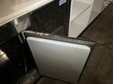 a small refrigerator with a door open in a kitchen