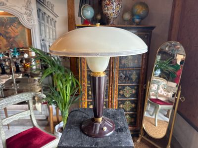 a lamp that is sitting on a table in a room
