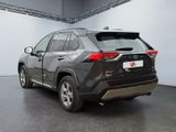the rear end of a gray toyota rav parked in a garage