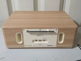 a wooden radio that is sitting on a table