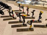 a lot of miniature figurines that are sitting on a table