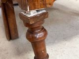 a close up of a bed with a wooden frame