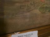 a picture of a painting on a shelf with a price tag on it