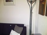 a couch and a lamp in the corner of a room