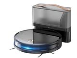a close up of a robotic vacuum cleaner on a white background