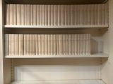many books on the shelves in the room