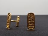 gold plated cufflinks with egyptian hieroglys on them