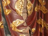 a statue of a man holding a sword in his hand