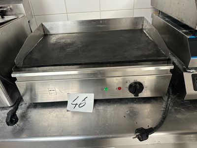 an electric griddle on the counter in the kitchen
