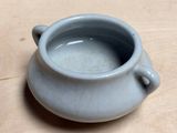 a small cup that is sitting on a table
