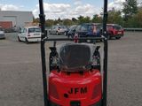 an image of a forklift parked in a parking lot