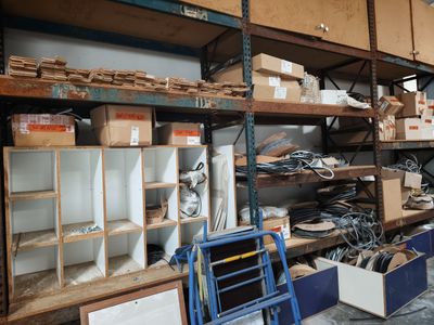 a room filled with lots of boxes and shelves