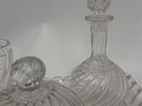 bottles and glasses on a table with a white background