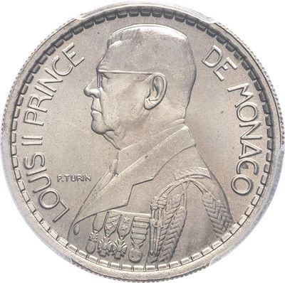a close up of a coin with a man ' s face on it