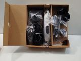 a box with two remotes in it on a table