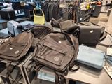 a lot of bags that are sitting on a table