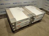two boxes of files are stacked on a pallet in front of a wall