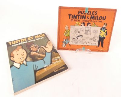 deux livres pour enfants sont posés l'un à côté de l'autre sur une table