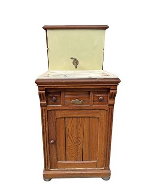 a wooden cabinet with a sink on top of it