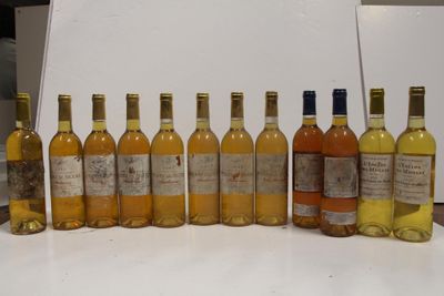 several bottles of wine are lined up on a table