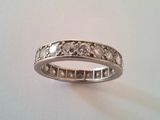 a close up of a ring on a table with a white background