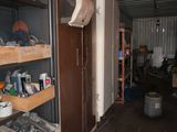 a room that has a lot of shelves and tools in it