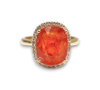 an orange fire opal and diamond ring