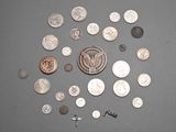 a lot of coins that are on the table
