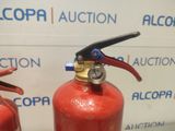 two red fire extinguisors sitting next to each other