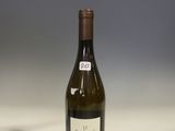 a bottle of wine that is sitting on a table