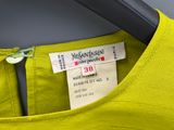 an image of a yellow shirt with a label on it