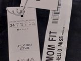 two tags on the back of a pair of jeans